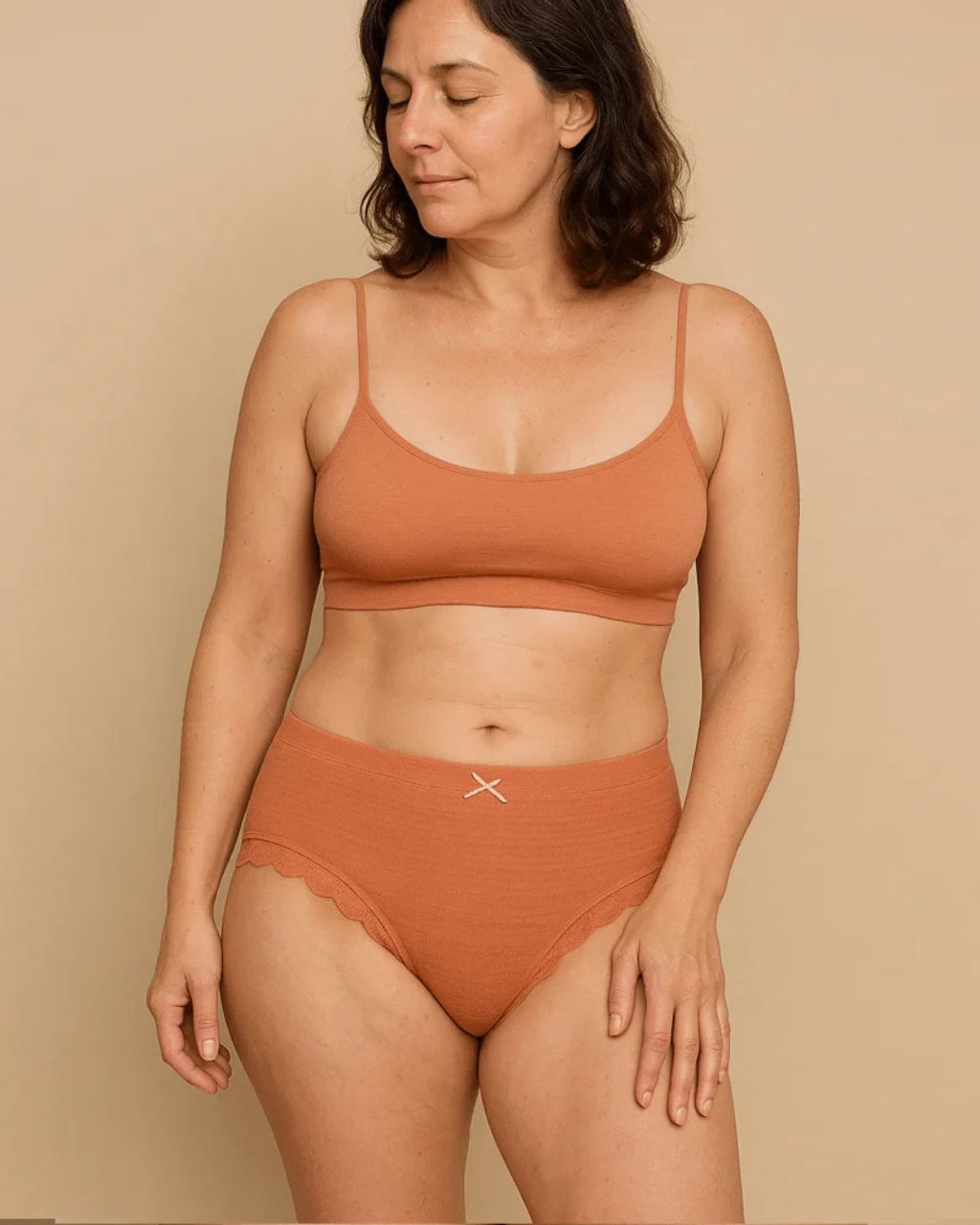 A single green leaf against a white background.